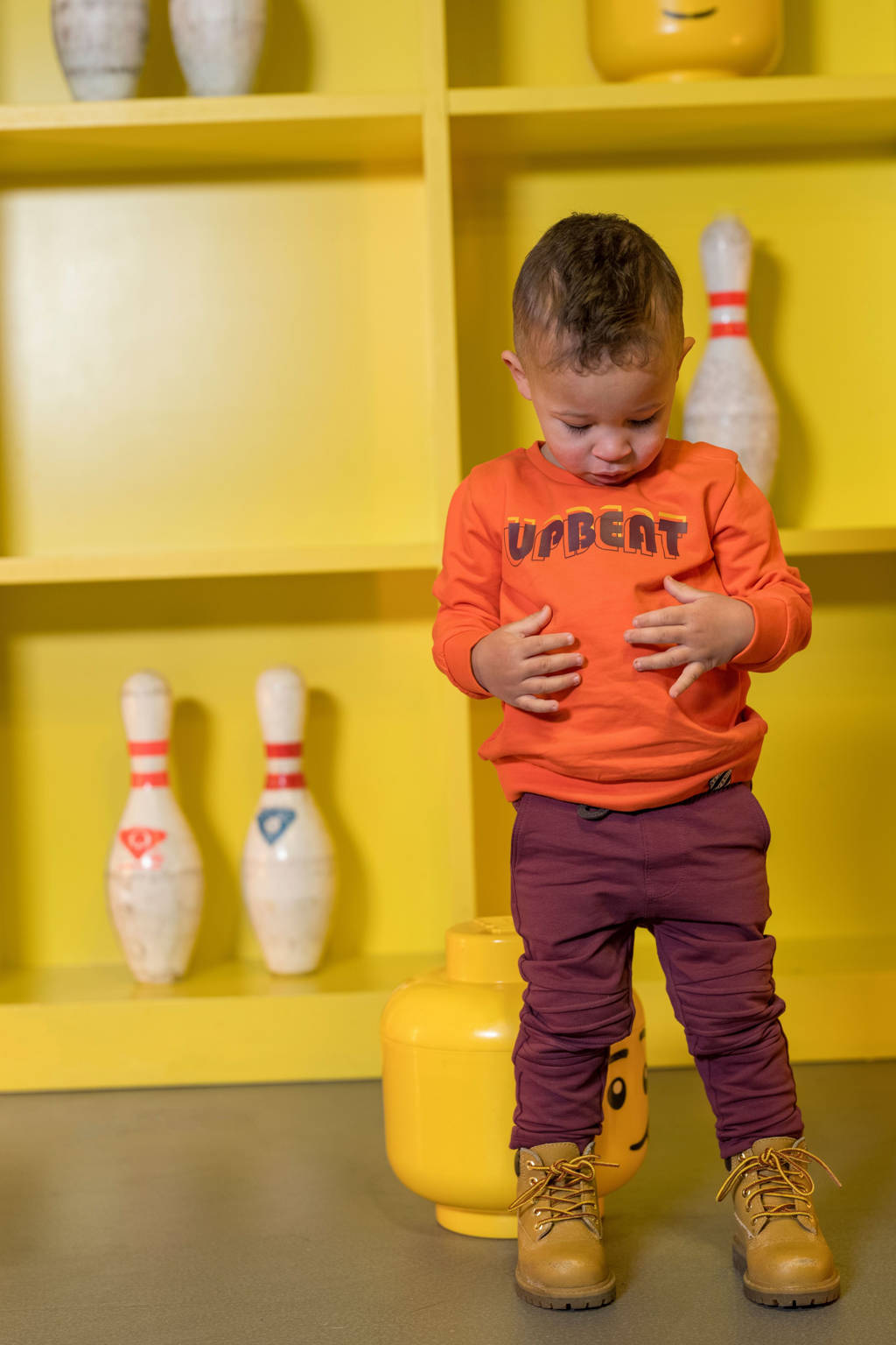 B.Nosy baby sweater Skyler met tekst oranje