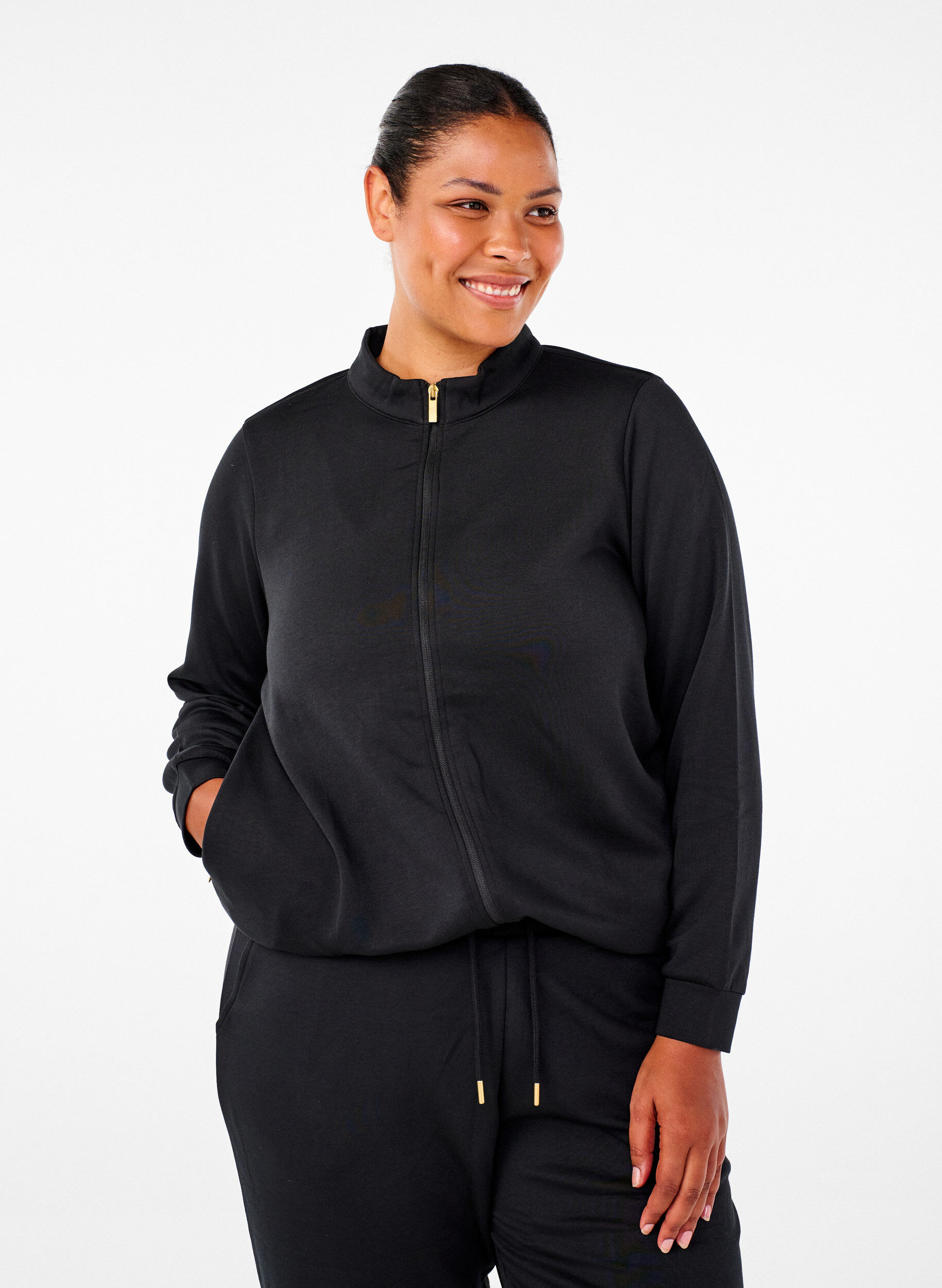 Sporty cardigan med lynlås og lommer