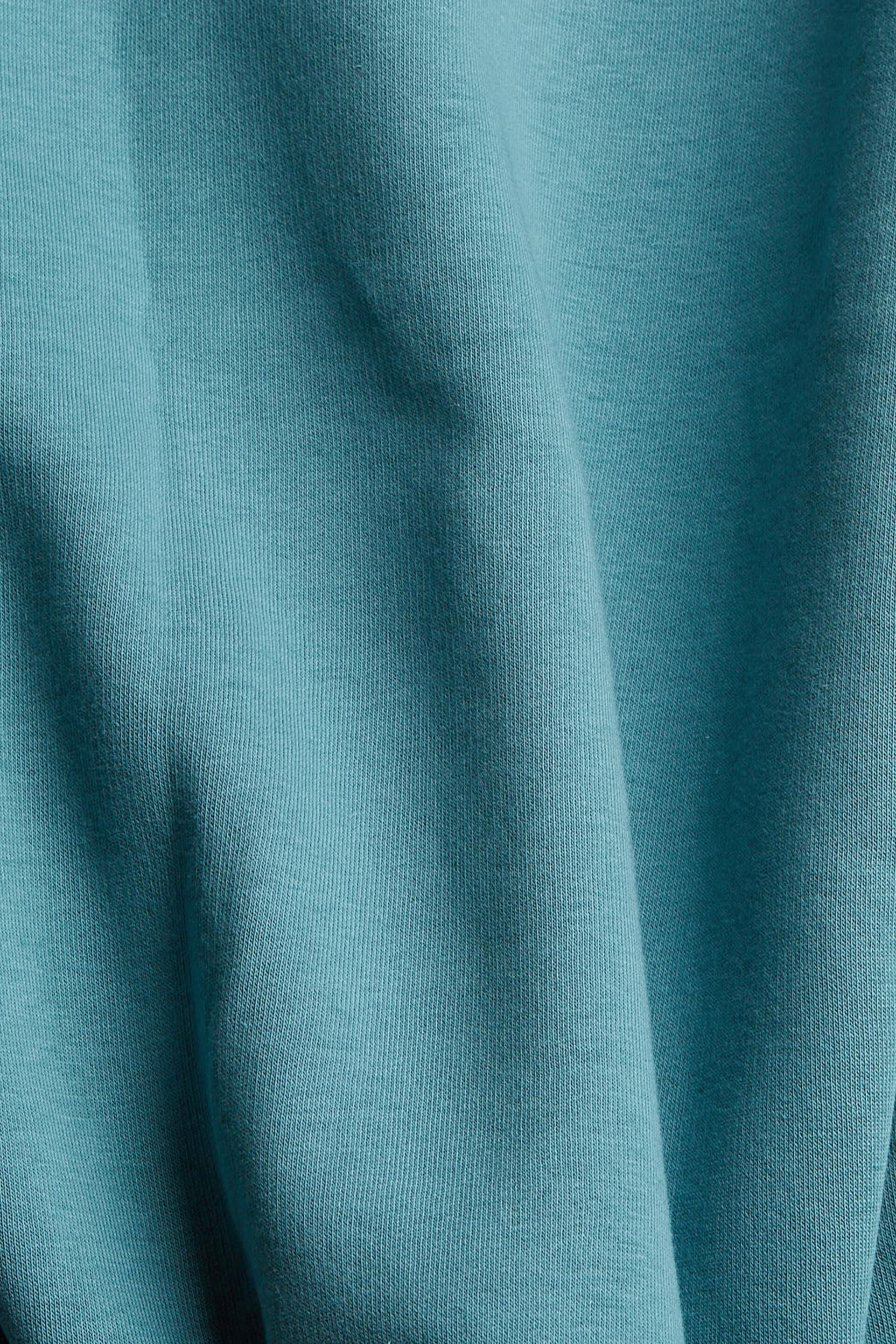 En matière recyclée le sweat à capuche orné d´un imprimé
