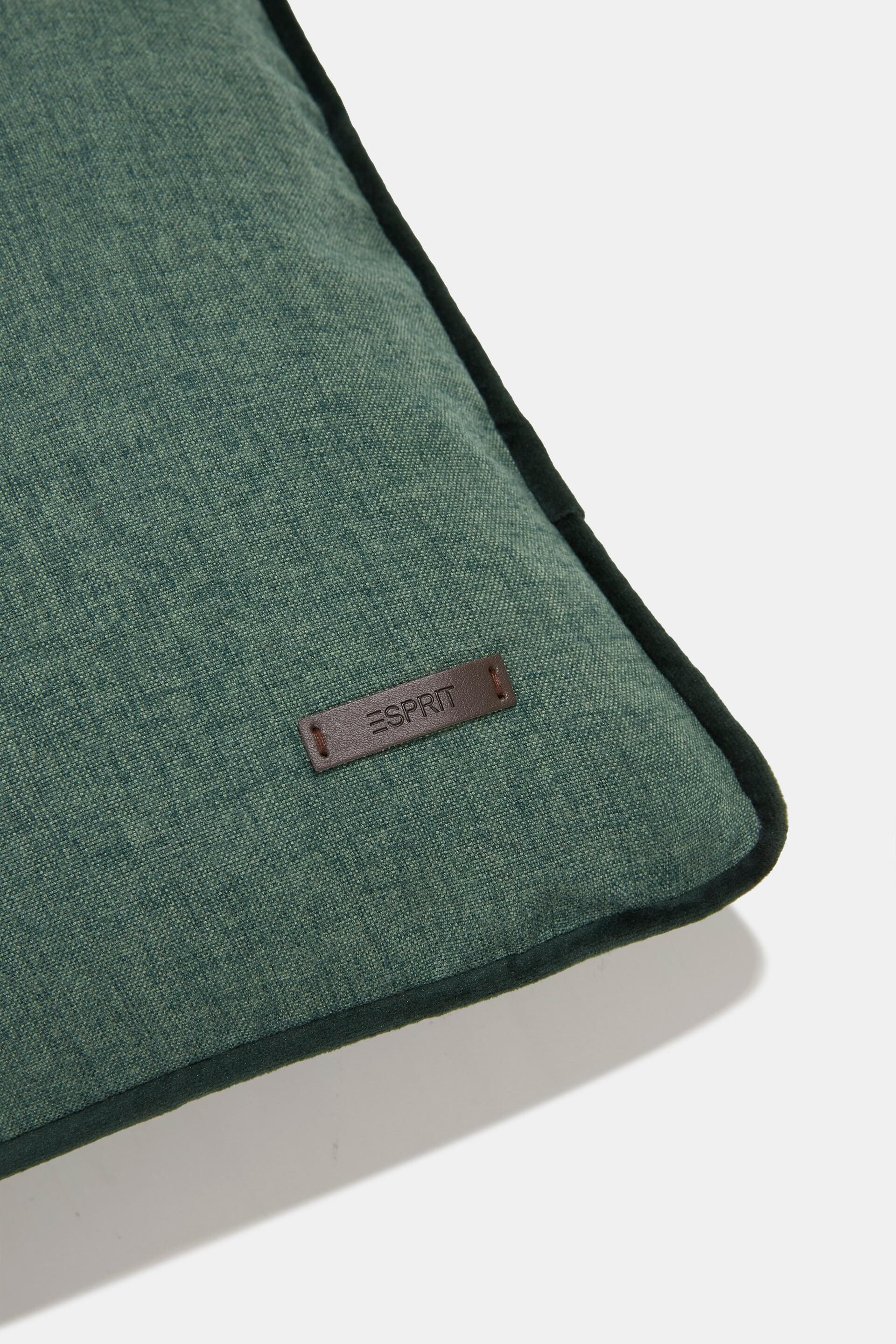 Housse de coussin décorative rehaussée d’un passepoil en velours