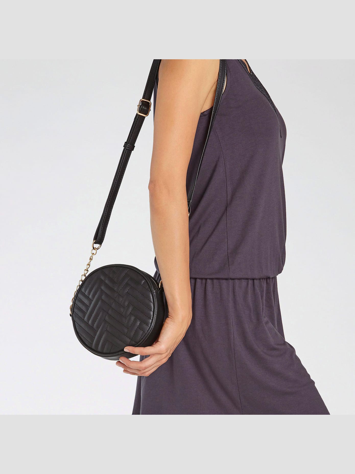 Sac en bandoulière mini-sac avec détails chaînes couleur or au niveau de l'anse