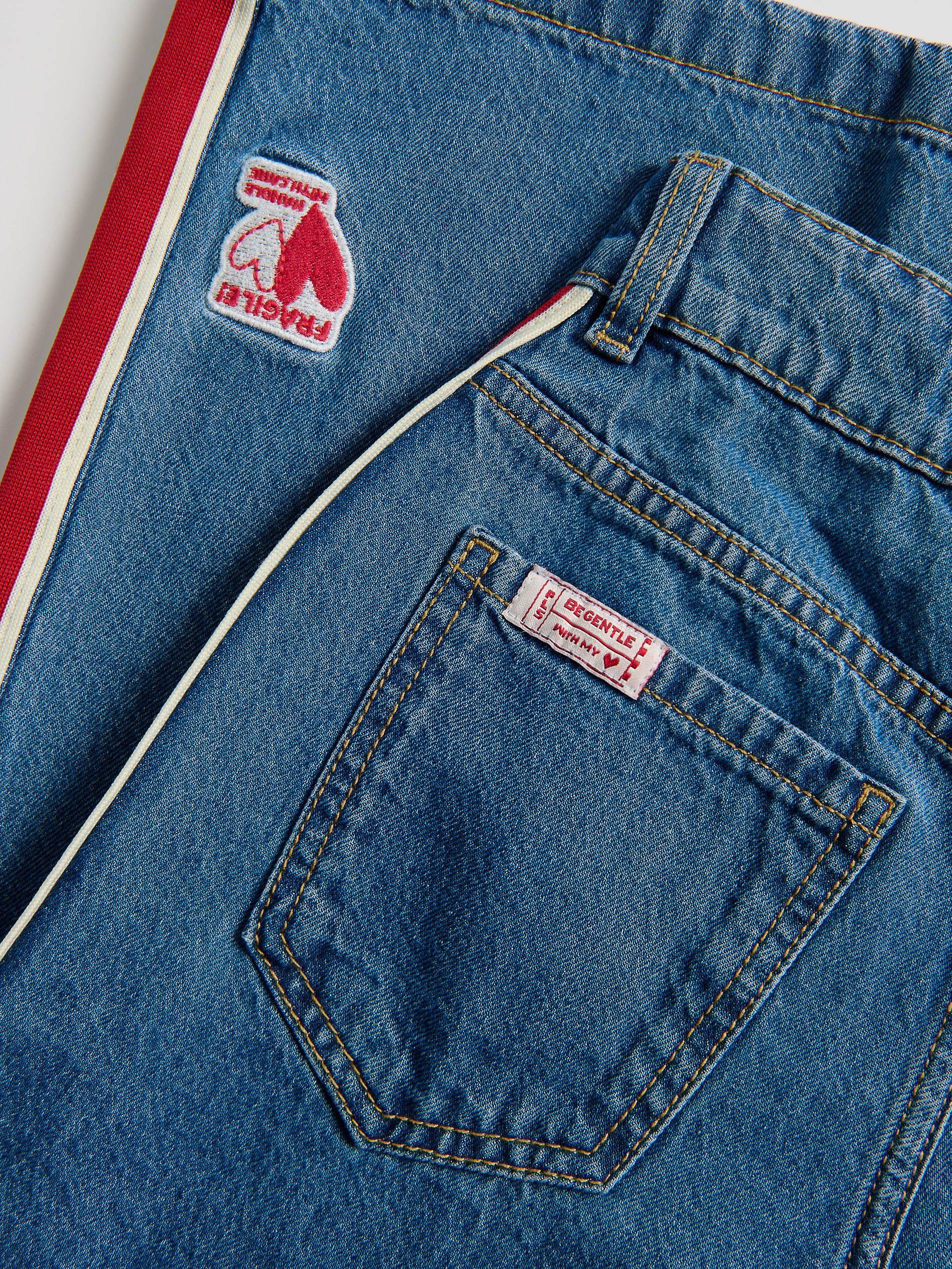Superweite Jeans mit Seitenstreifen