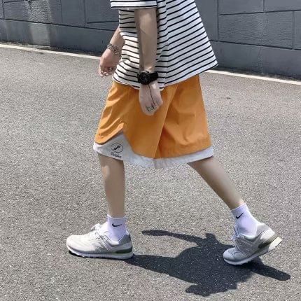 Macho - Tweekleurige shorts met wijde pijpen en trekkoord in de taille