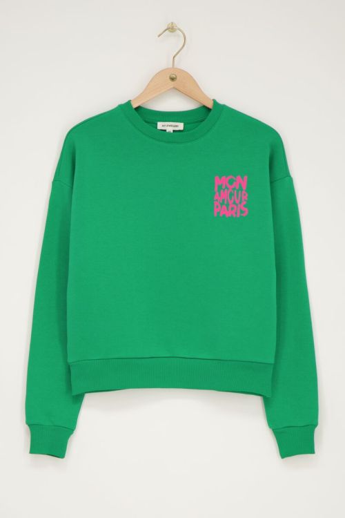 Groene sweater met roze 