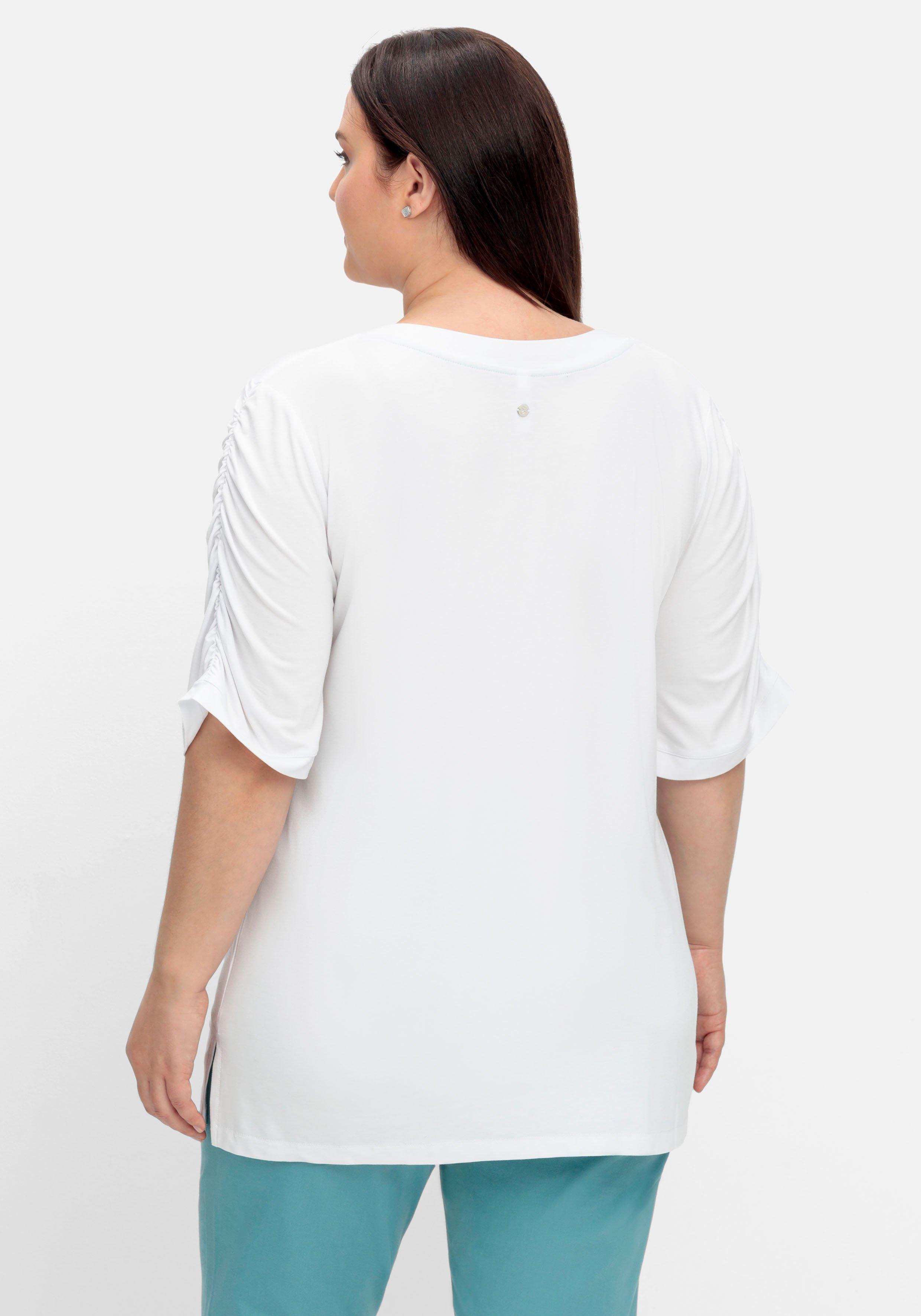 Shirt mit Blütenprint am Saum