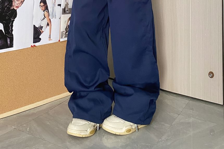 MELLO - Wijde broek met middelhoge taille en geruit paneel en letters