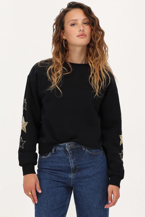 Zwarte sweater met goudkleurige sterren