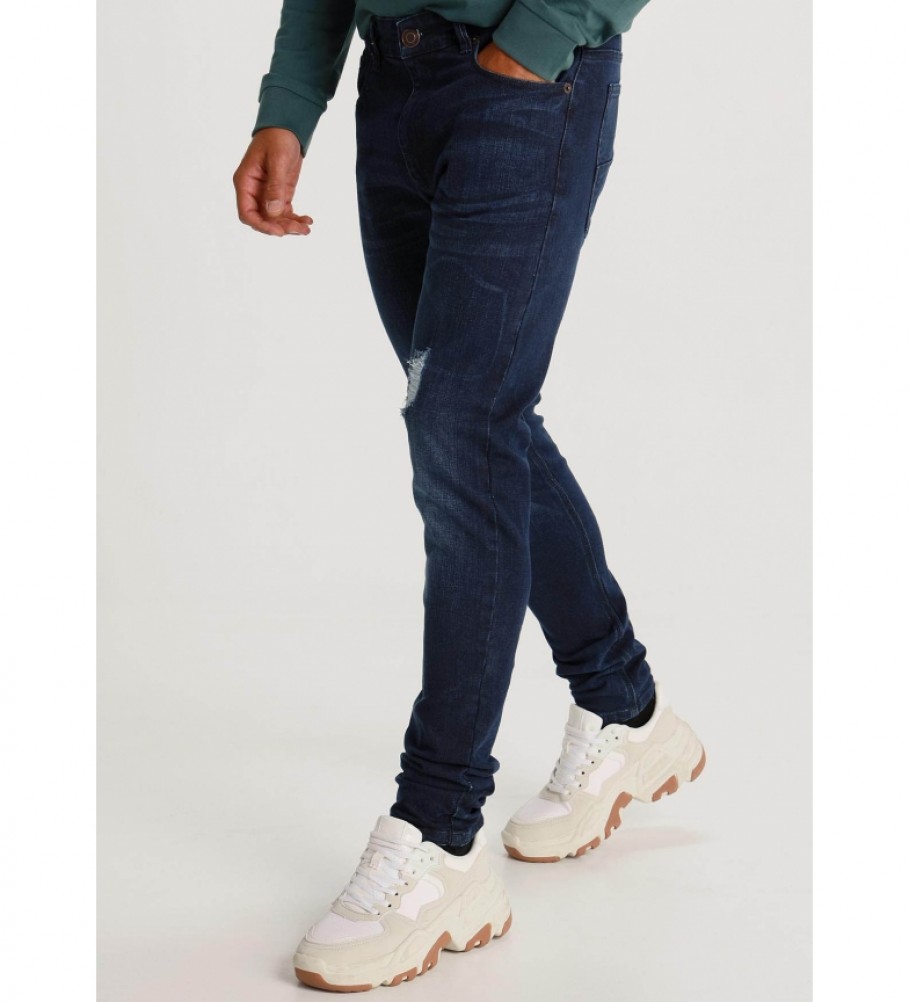 Calça jeans azul-escura rasgada da Six Valves