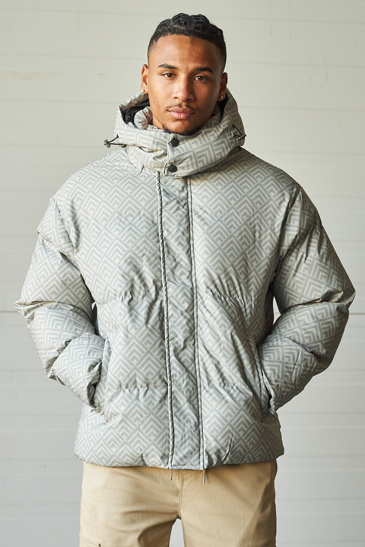 Doudoune beige mi-longue matelassée à chevrons gris