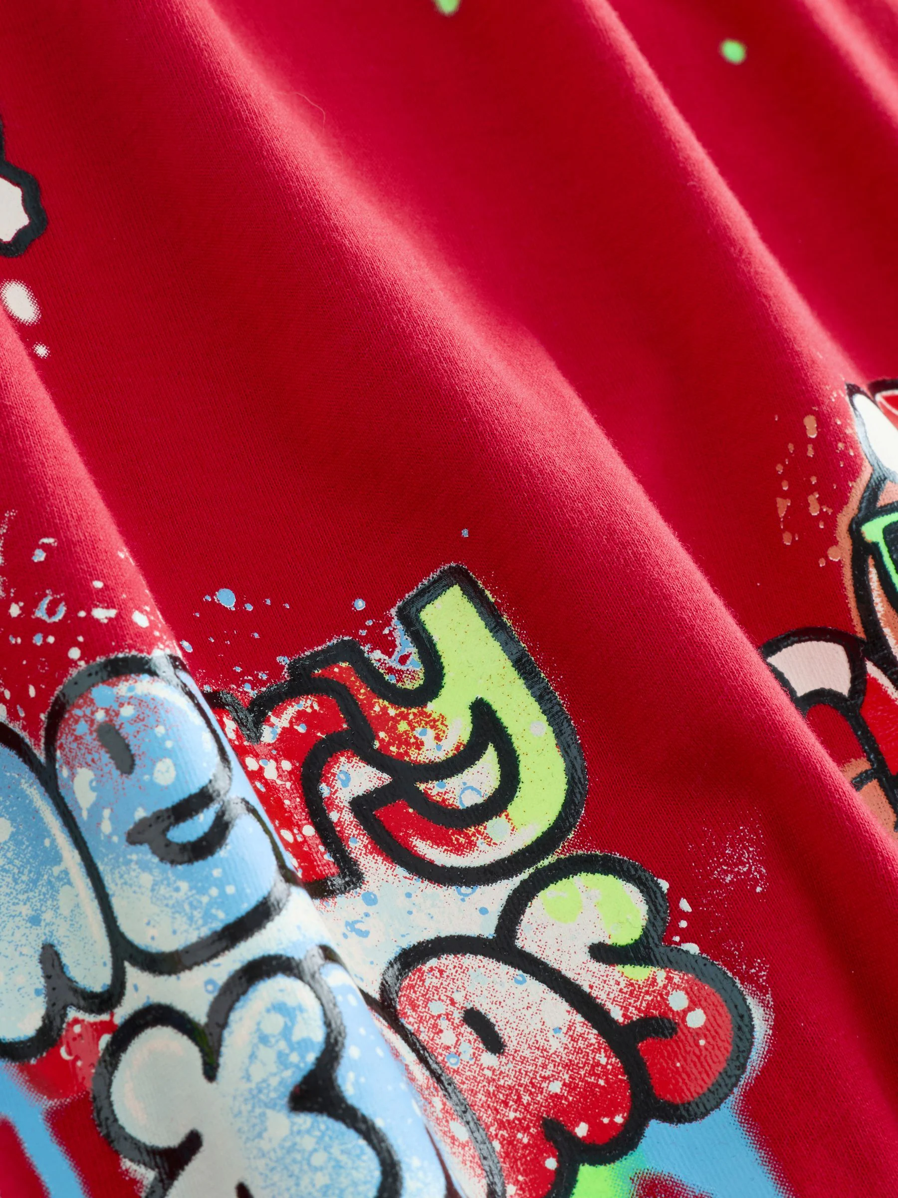 Zwart/rood/geel graffitiprint - Enkele kerstpyjama (3-16jr)