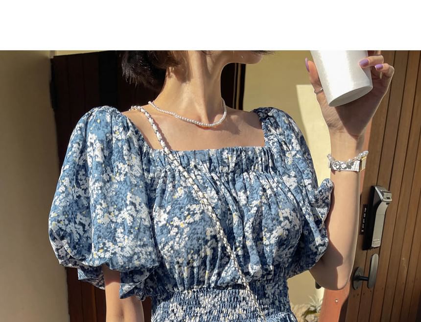 Coris - Romper met korte mouwen, off-shoulder bloemenprint en wijde pijpen