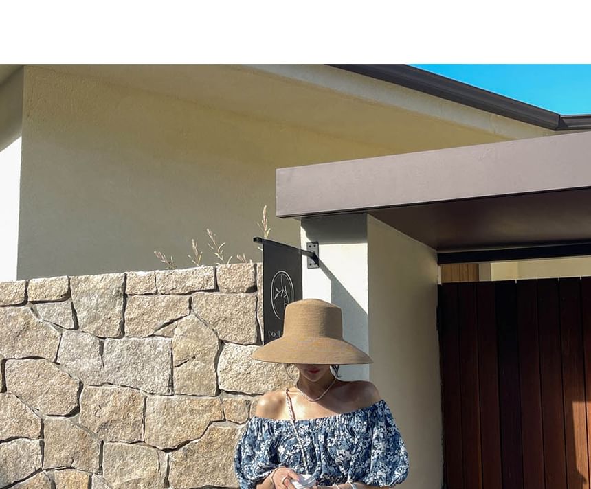 Coris - Romper met korte mouwen, off-shoulder bloemenprint en wijde pijpen