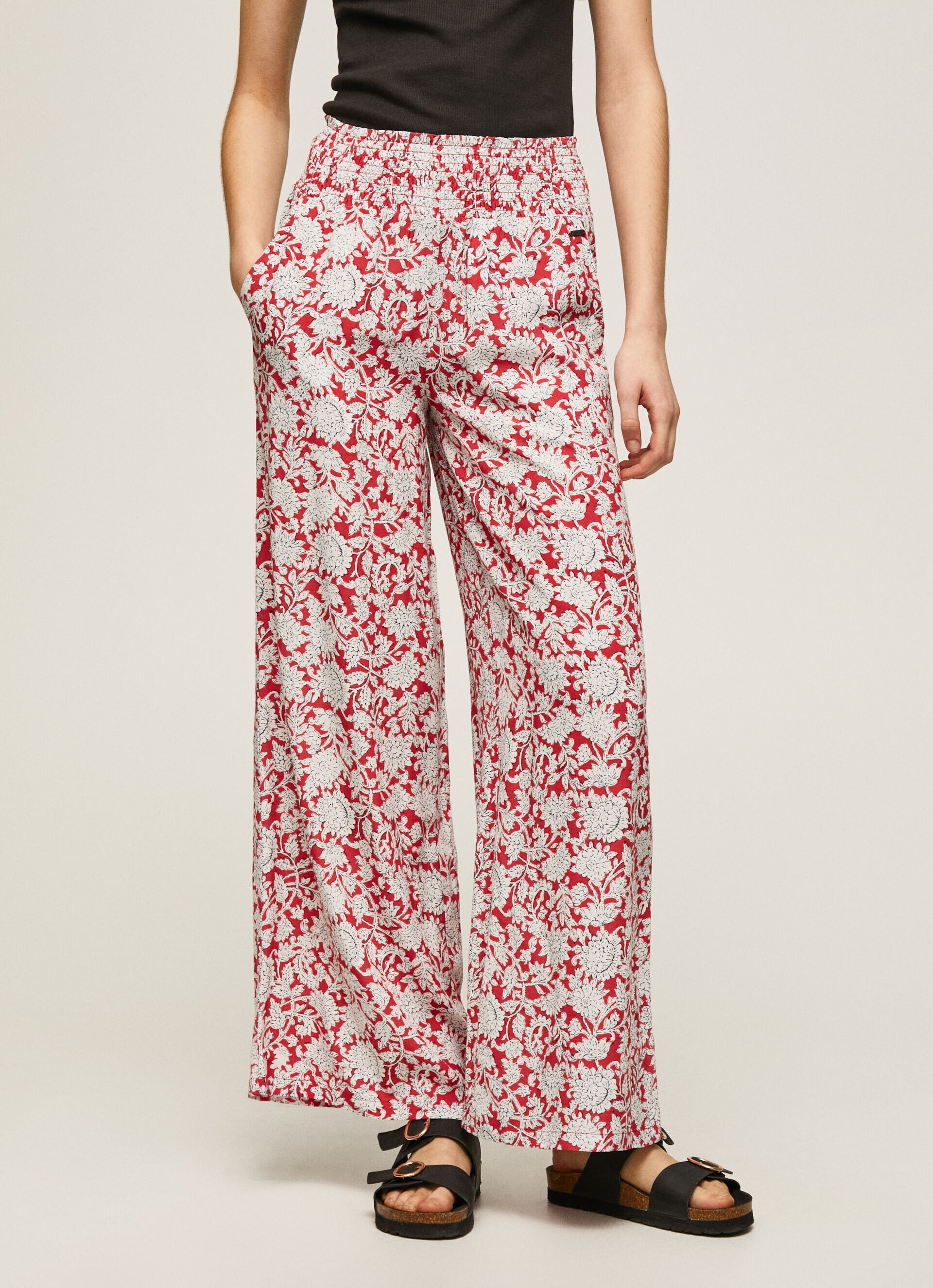 Calça de perna larga com estampa floral - multicolorida