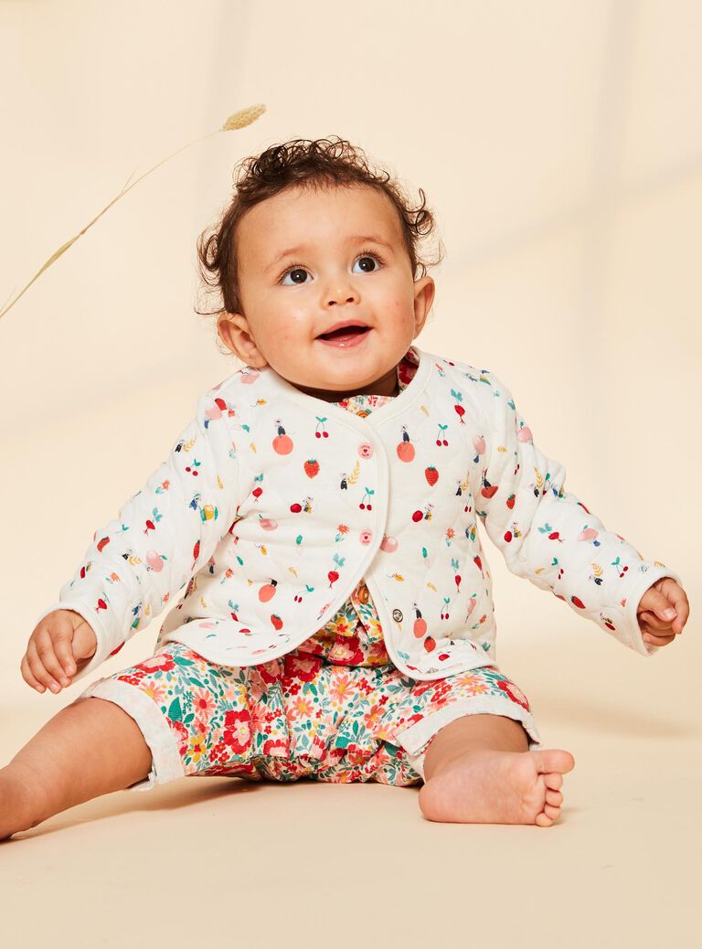 Gilet en tubique écrue avec surpiqures