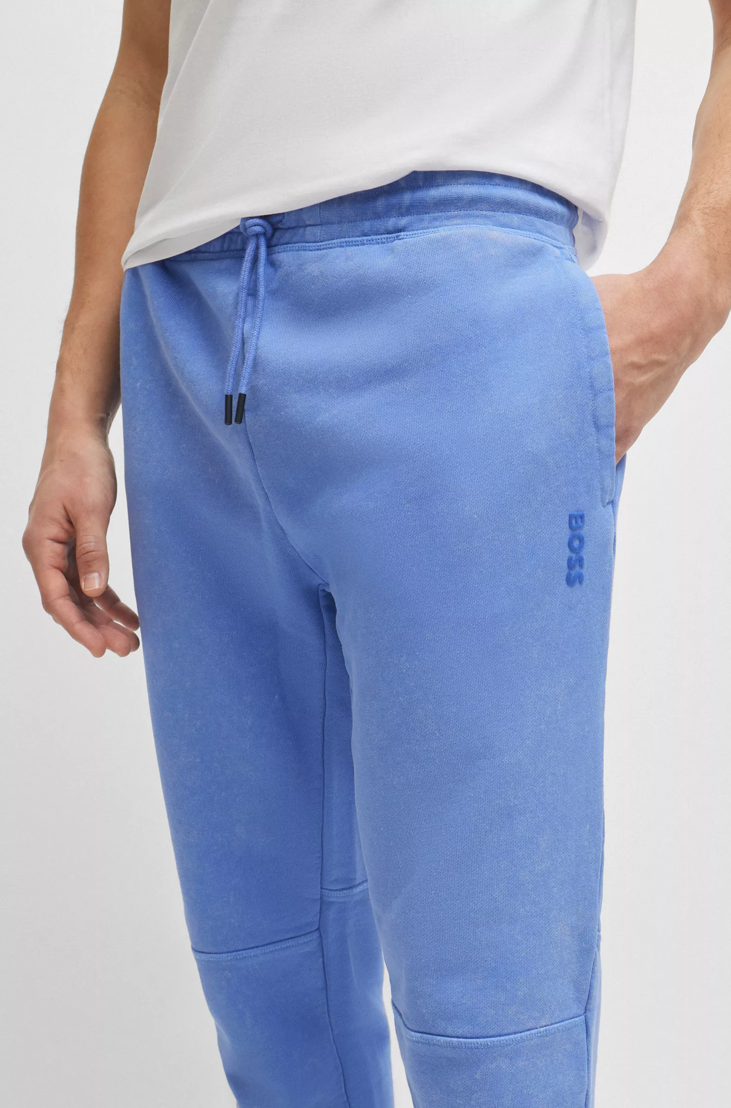 Calça de fato de treino BOSS em tecido atoalhado de algodão laranja com detalhe do logótipo