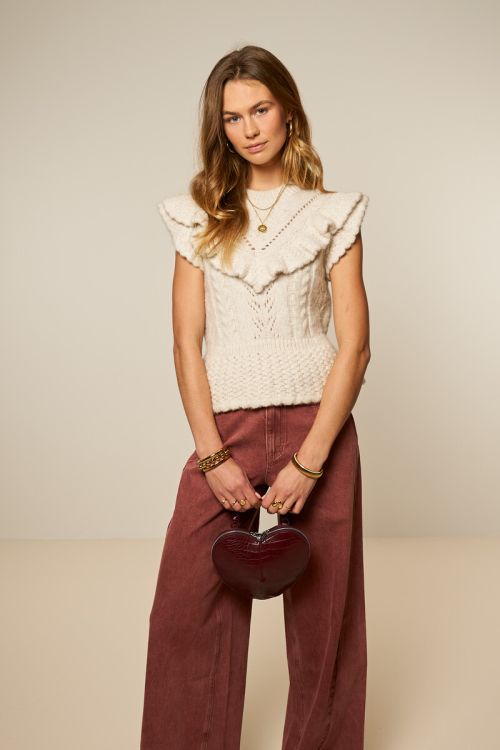 Beige spencer met ajour en ruffles