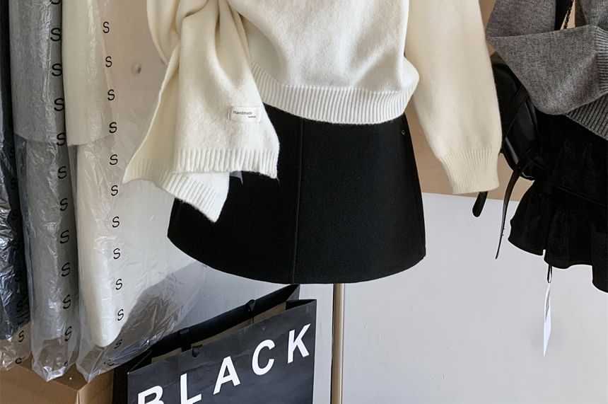 Dute - Cropped trui met kraag en strikhals