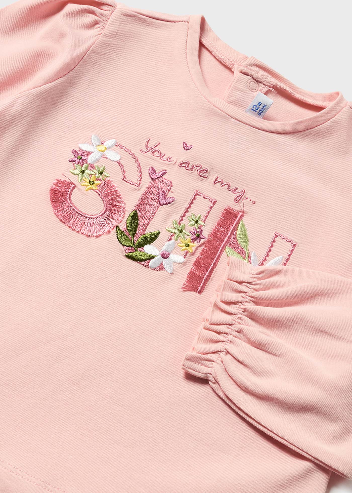 Camiseta de manga comprida feita de algodão sustentável para bebês