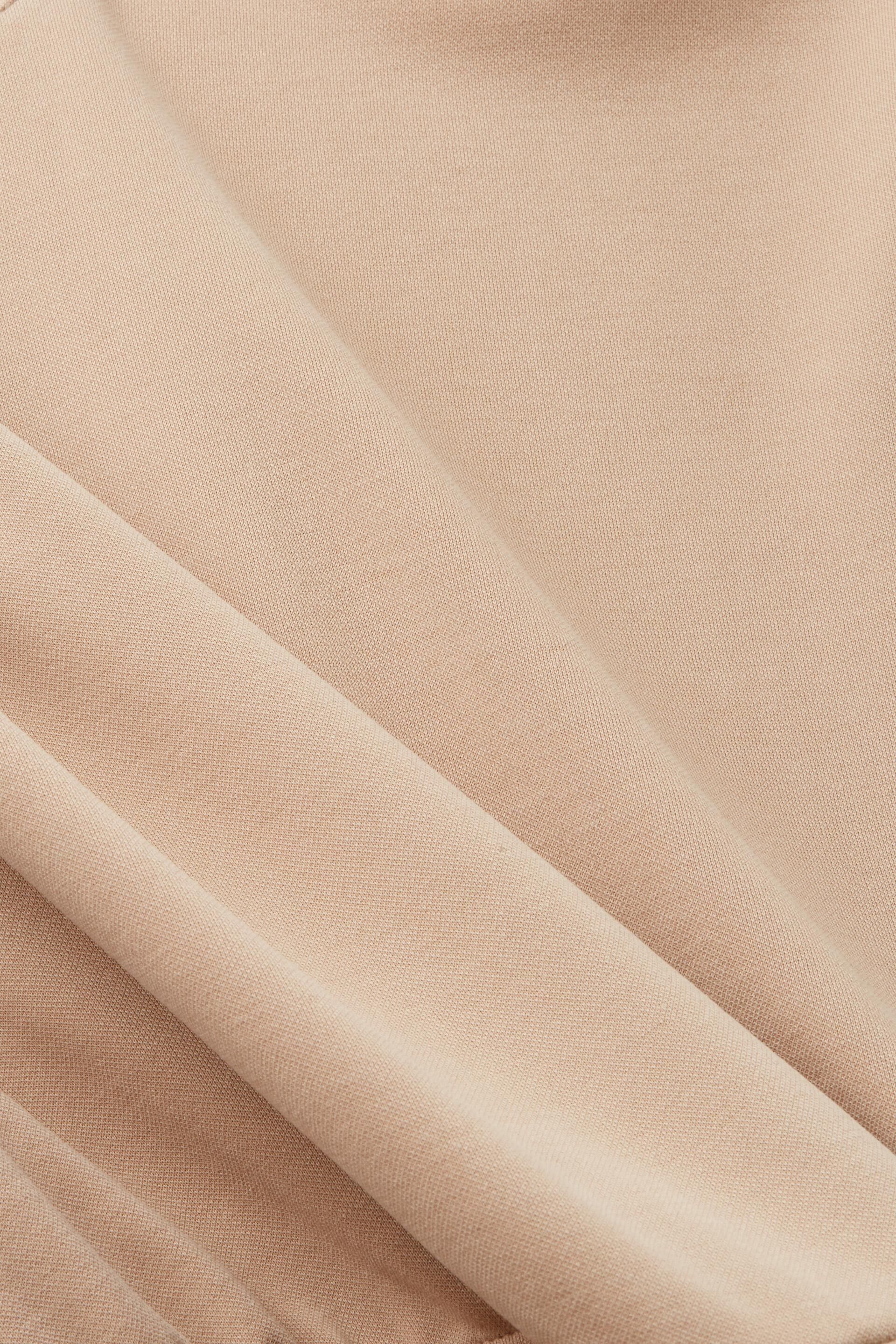 Combinaison en modal à nœud à la taille
