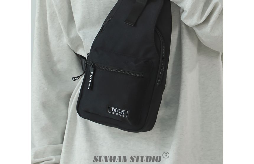 SUNMAN - Nylon schoudertas met applicatie en gesp