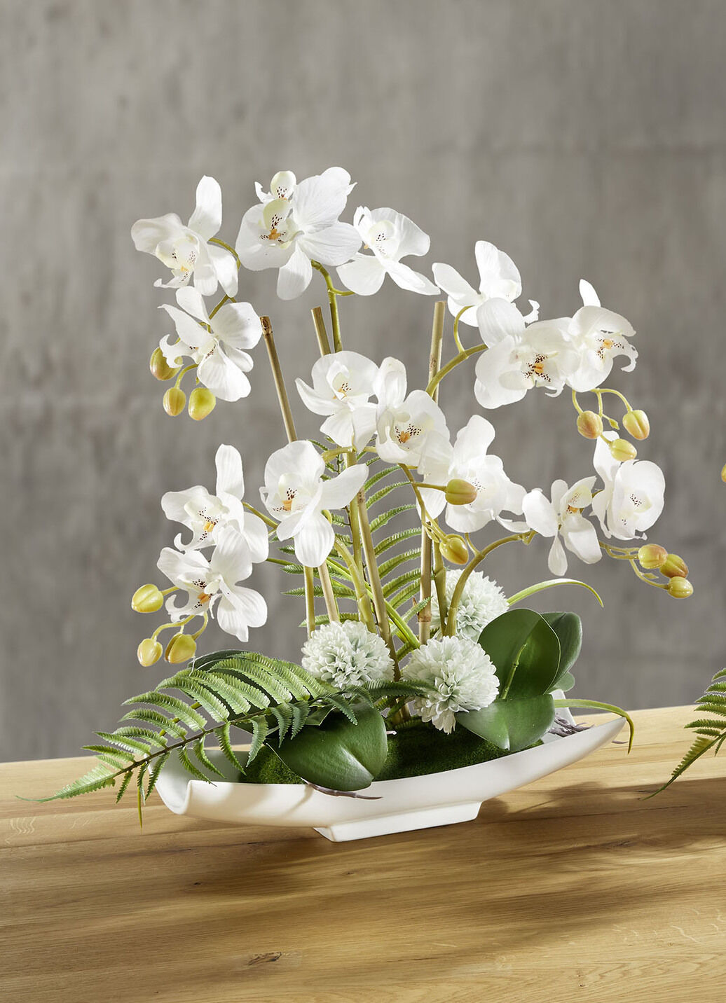 Orchideen-Arrangement in Schale