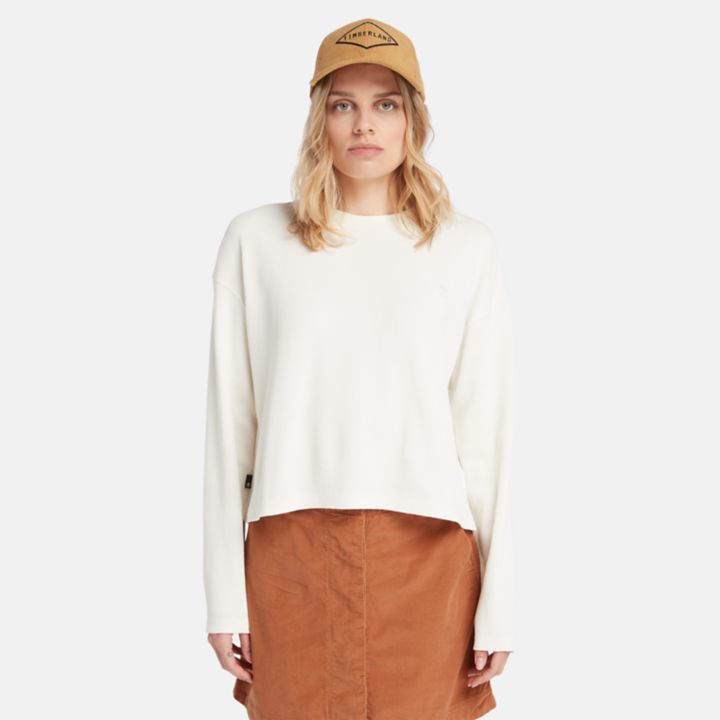 Camiseta feminina de manga comprida com textura waffle na cor branca.