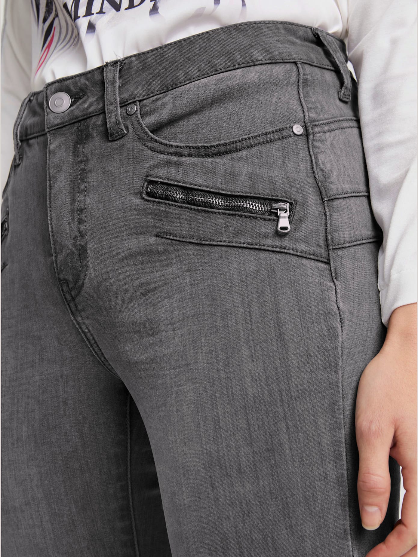 Jeans effet ventre plat glissières décoratives