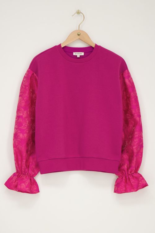 Roze sweater met jacquard mouwen
