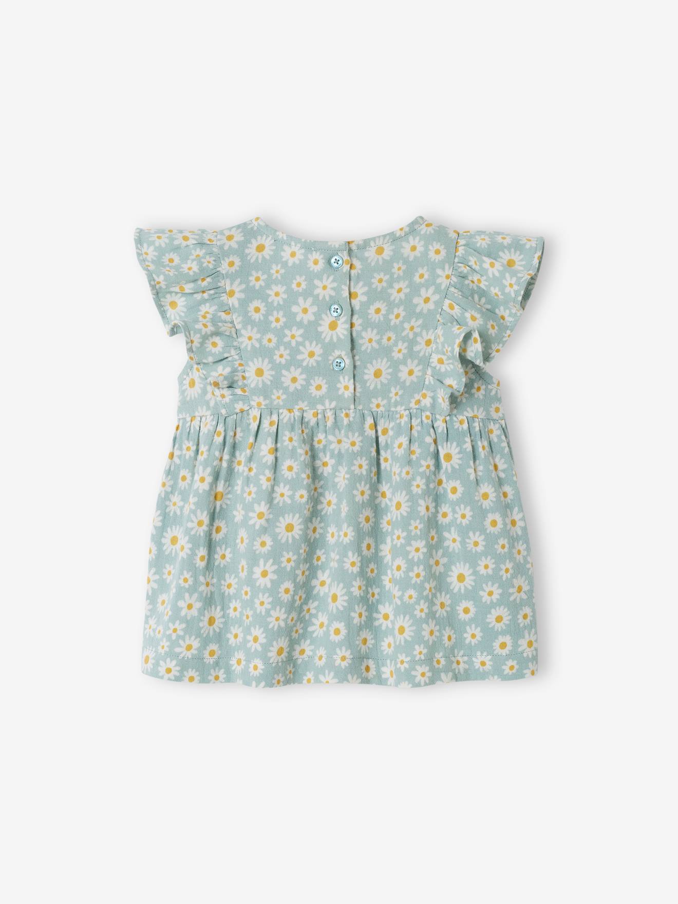 Blusa infantil azul acinzentada com babados.
