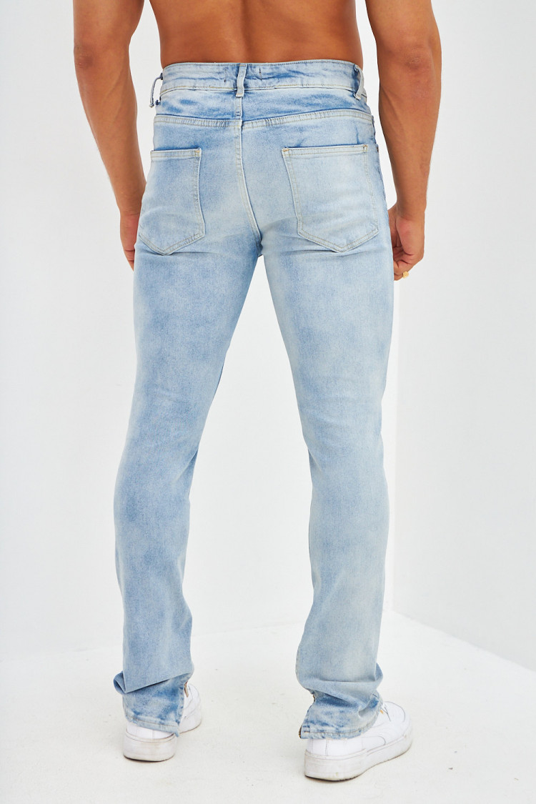 Jean slim effet déchiré bleu clair tâché