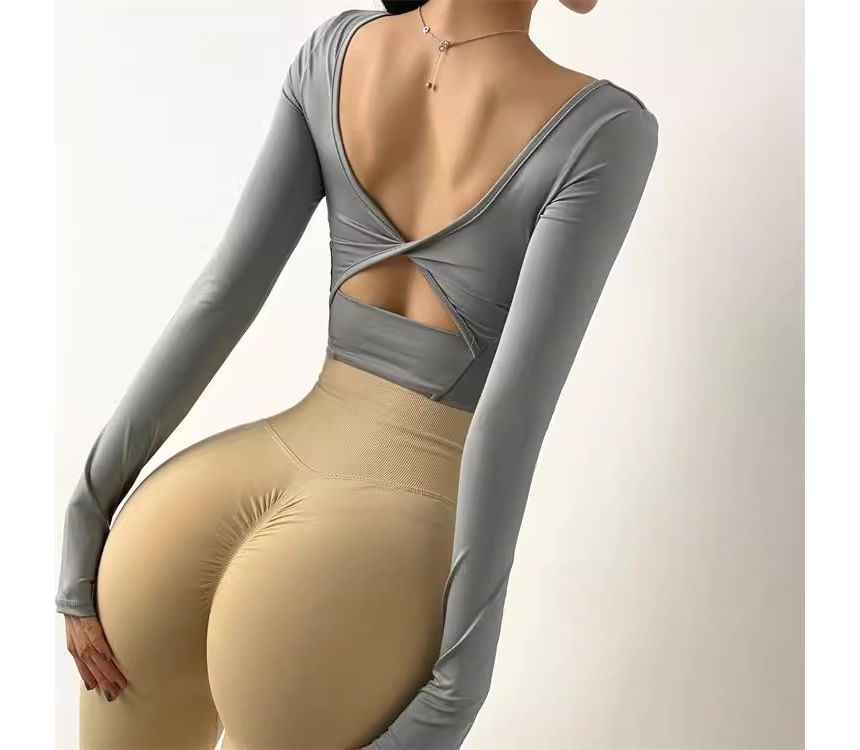 CUCURBIT - Sport T-shirt met lange mouwen en open rug