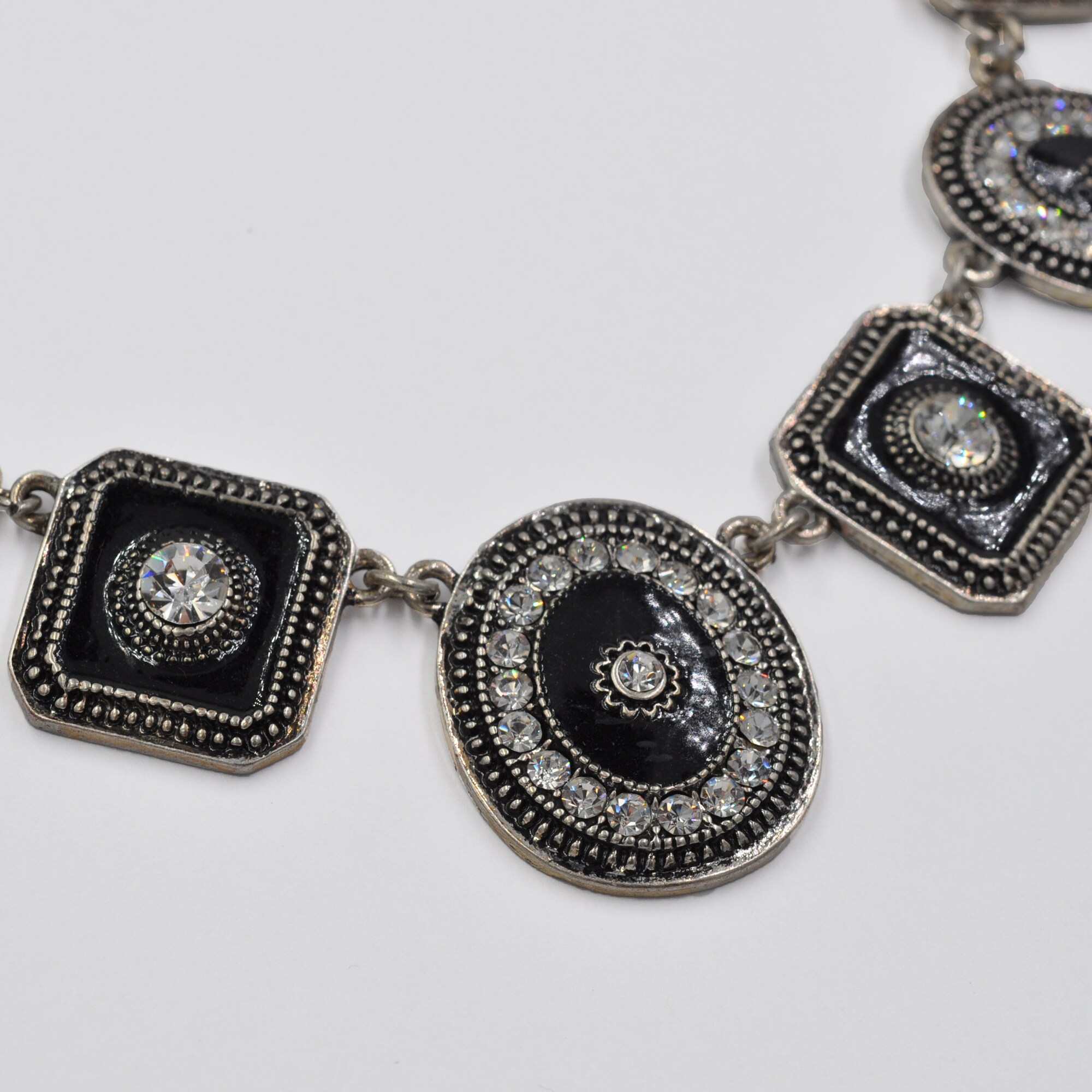 Steuer Modeschmuck Collierkette Metallcollier altsilberfarben mit 7 Anhängern mit Kristallstein