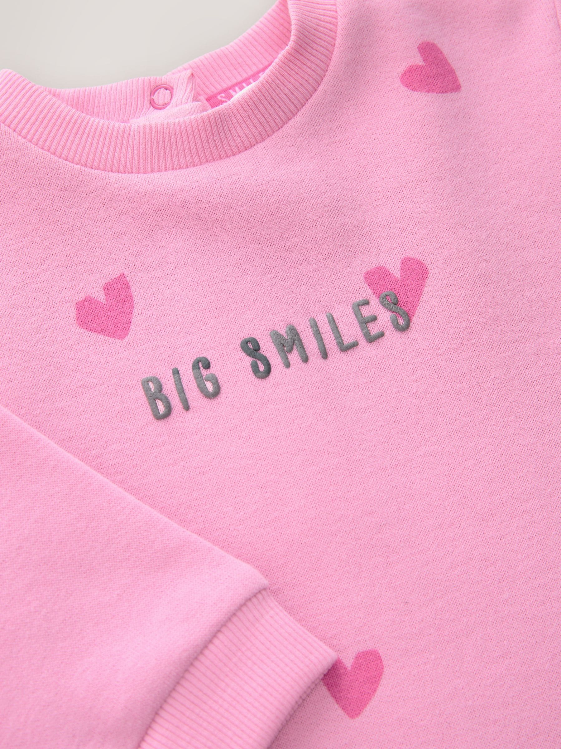 Roze met hartjesprint - Jersey babyromper (0mnd-3jr)