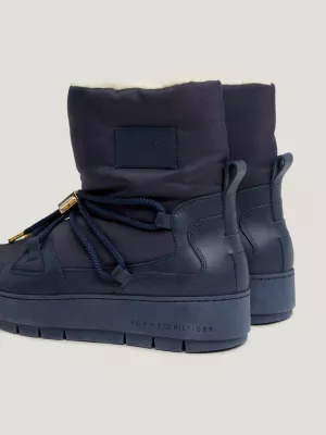 Botas de neve essenciais com forro quente e travas.
