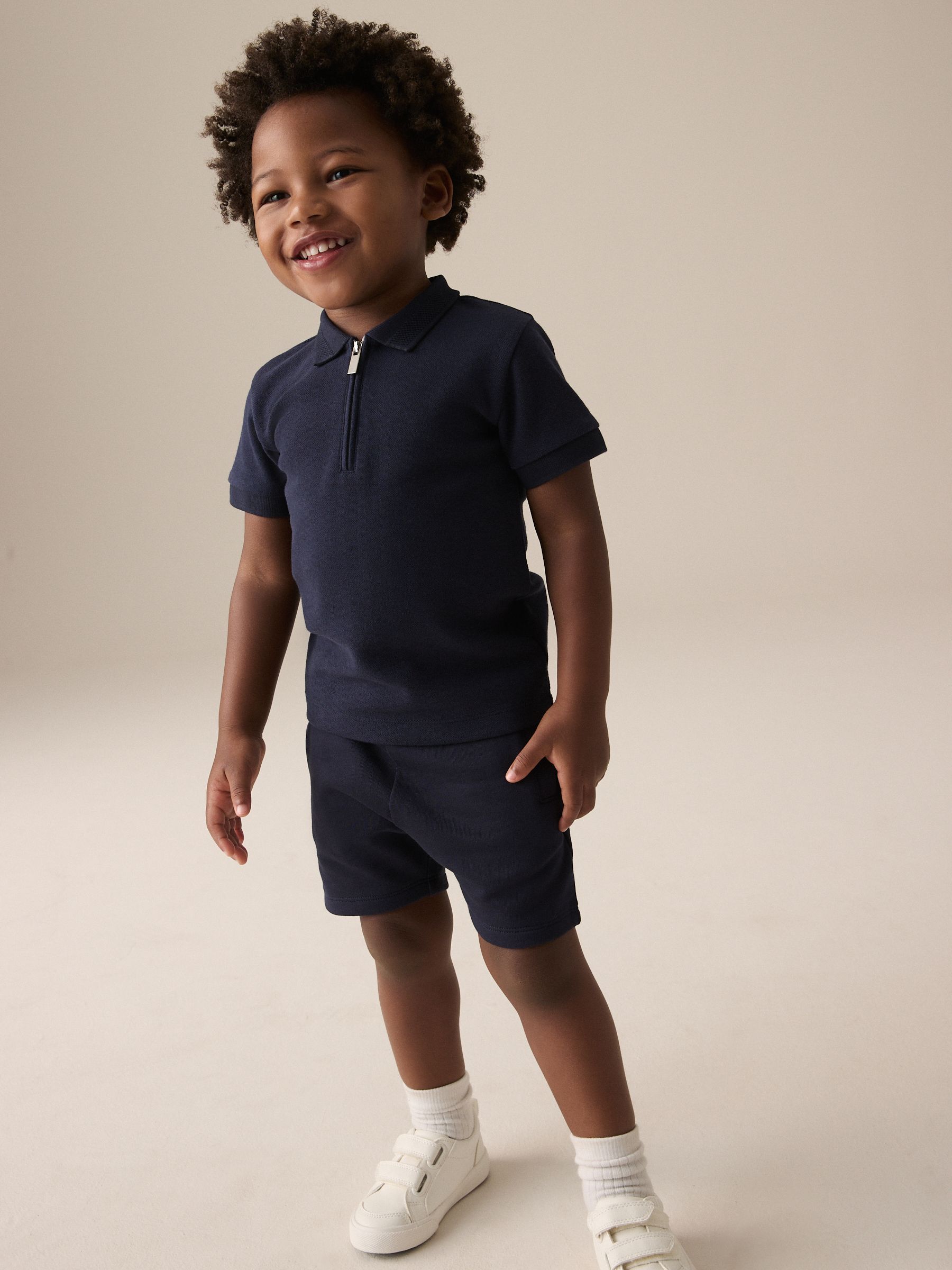 Marinablauw getextureerd - Set van poloshirt met korte mouwen, rits bij de hals en short (3mnd-7jr)