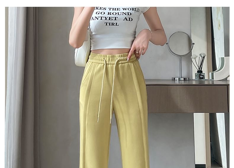 Tel tot 10 - Effen wijd uitlopende broek met trekkoord in de taille (verschillende ontwerpen)