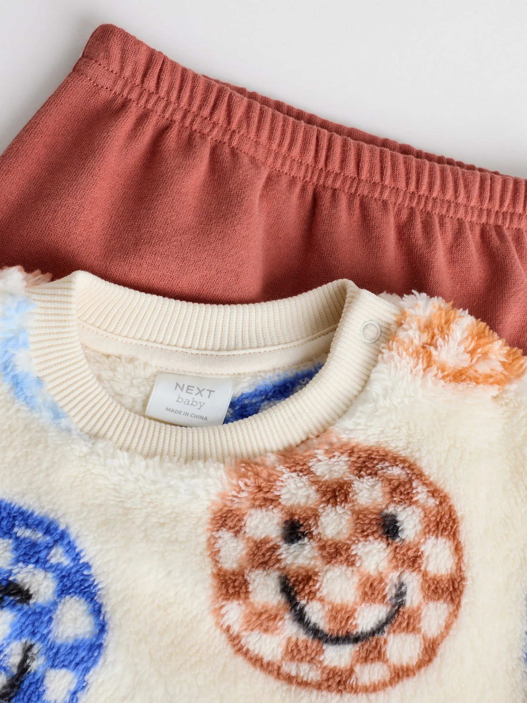 Blauwe gezichten met dambordmotief - Set van fleece top en joggingbroek voor baby's (0mnd -2jr)