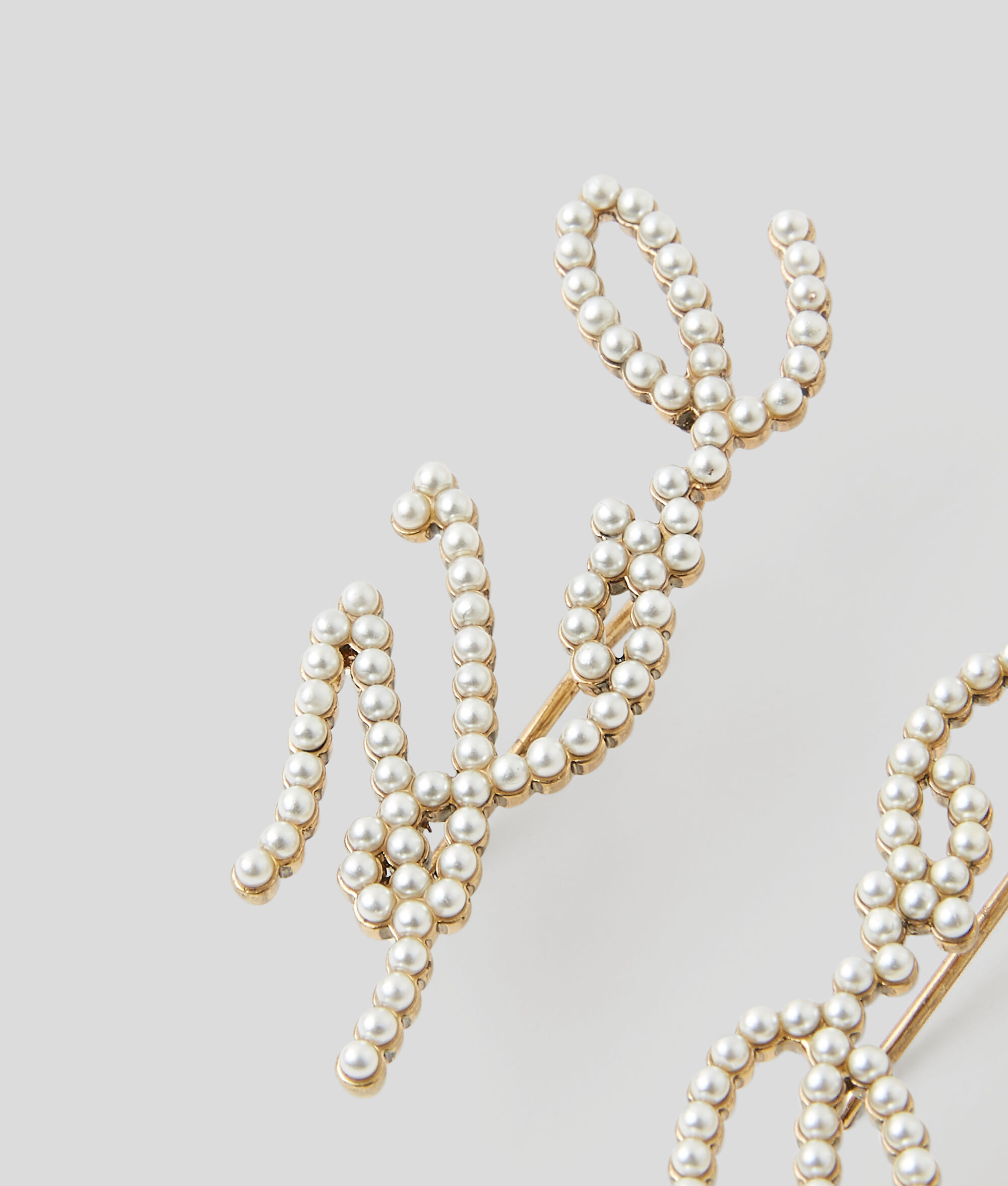 CLOUS D'OREILLES EN PERLES K/SIGNATURE