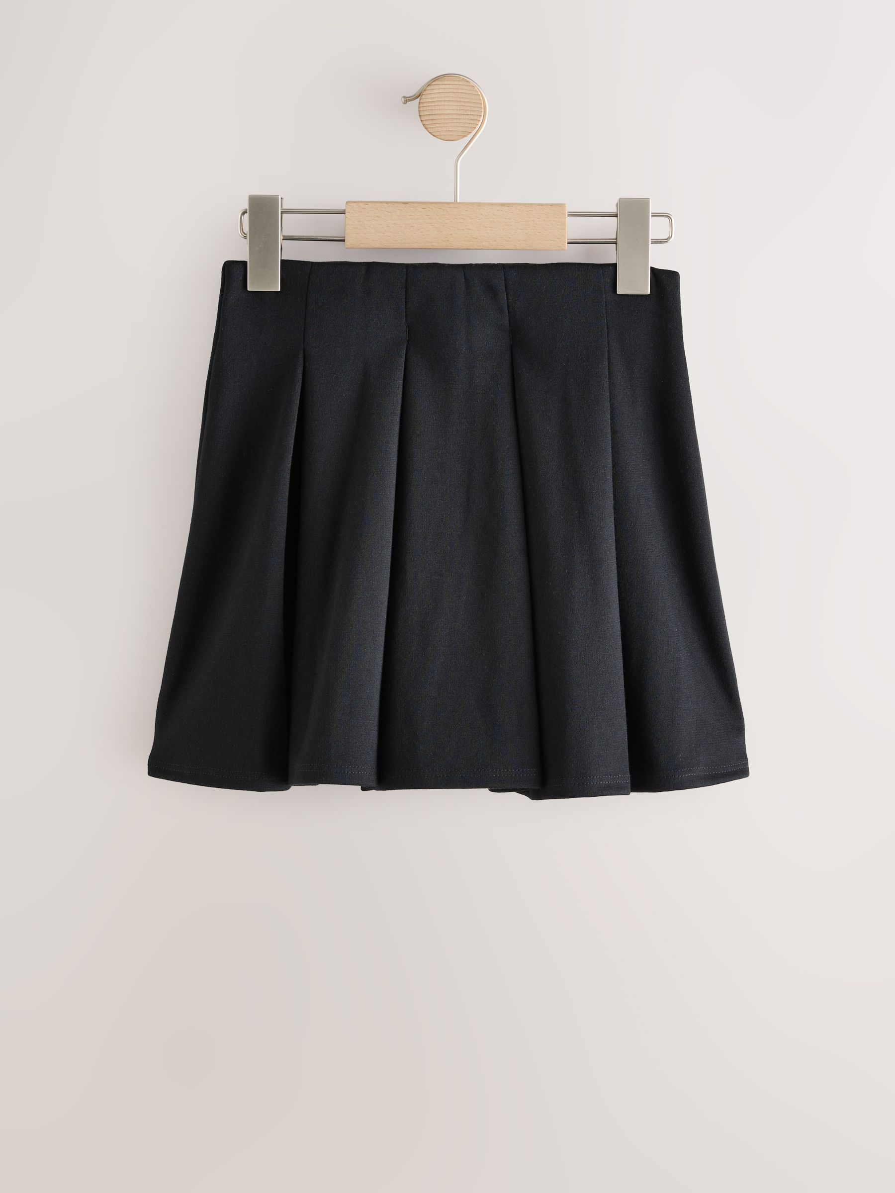 Zwart - Jersey pull-on geplooide schoolrok met stretch (3-17jr)