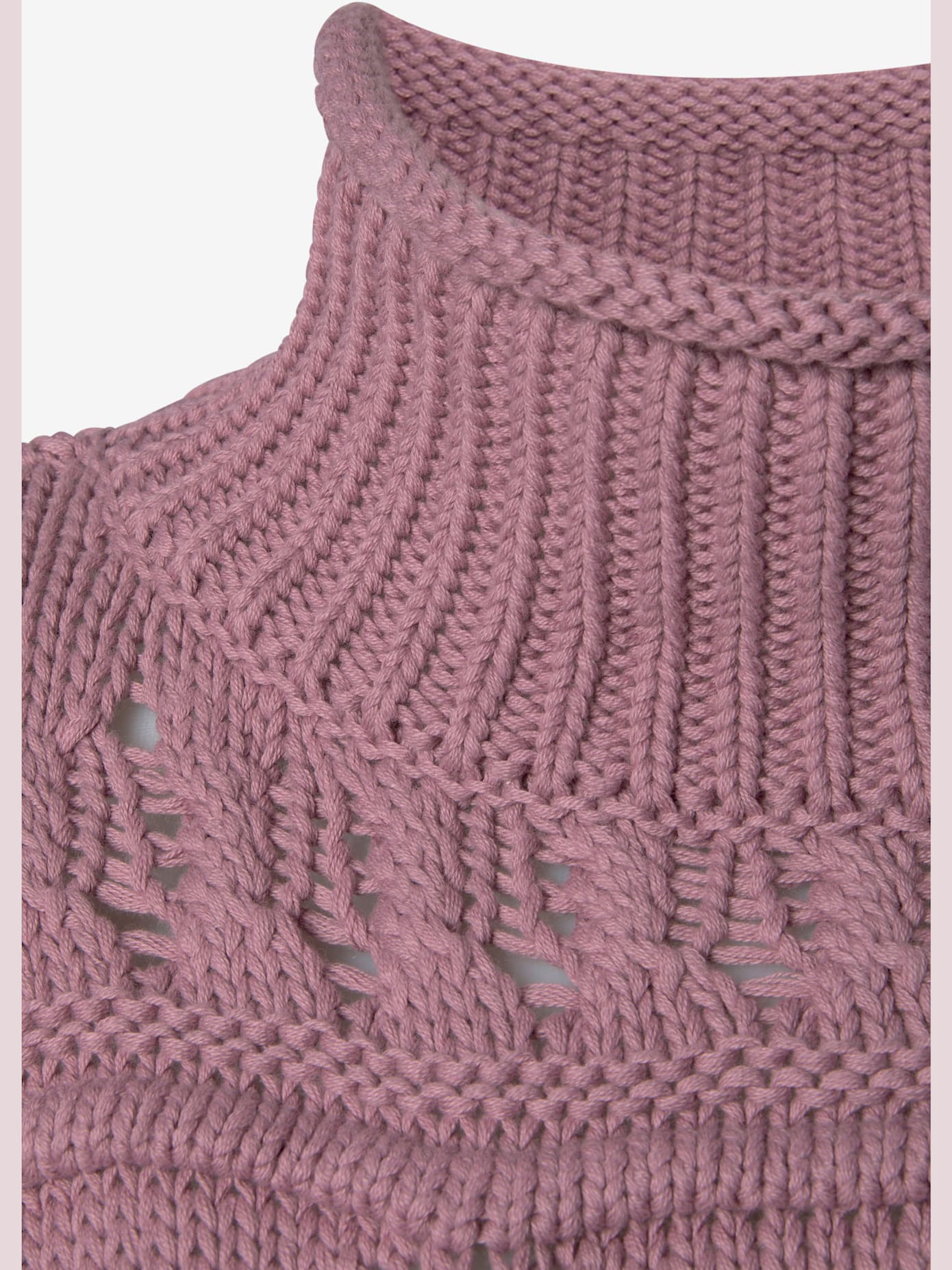 Pull col roulé en tricot ajouré