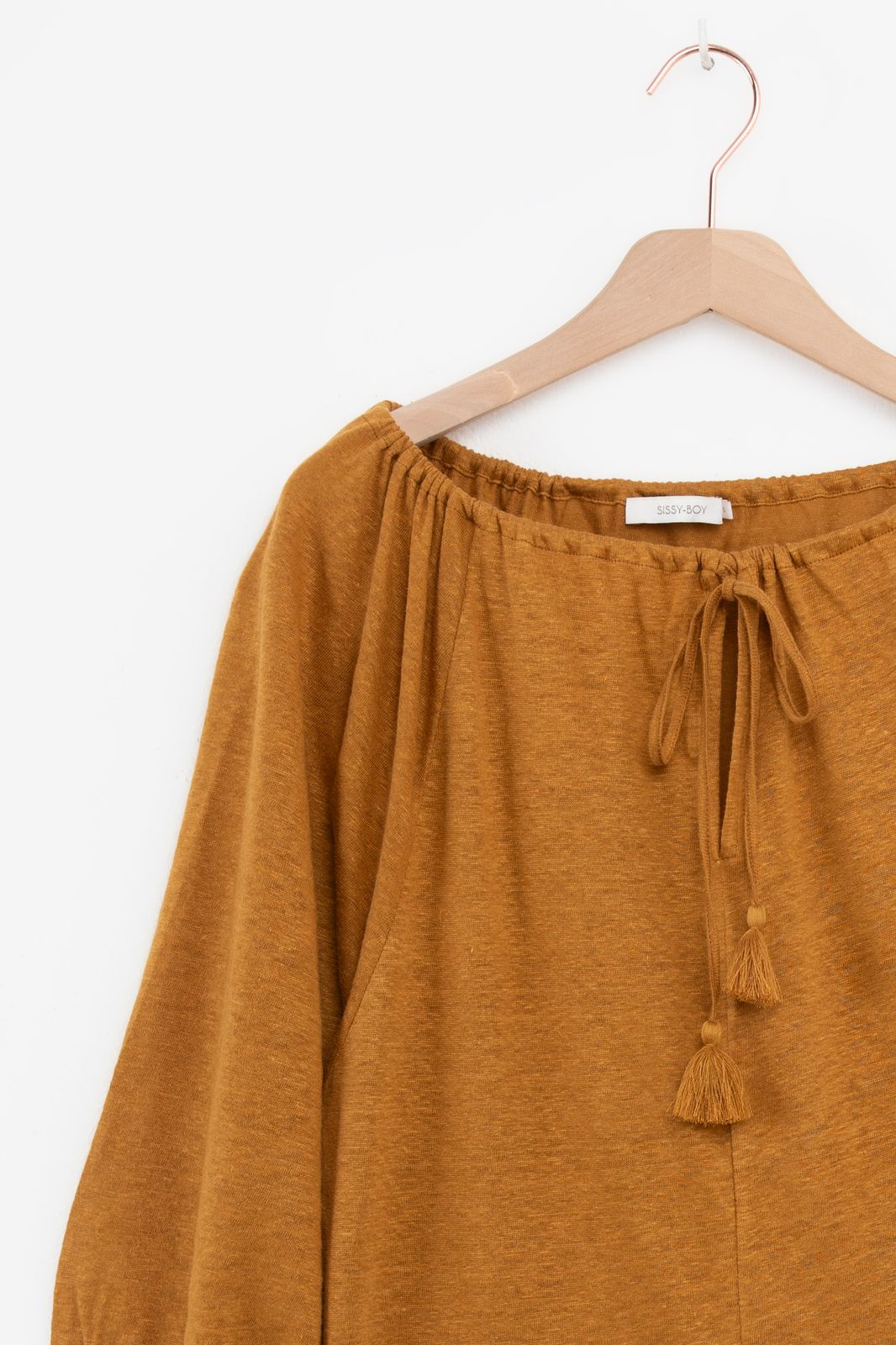Goudbruine top met kwastjes