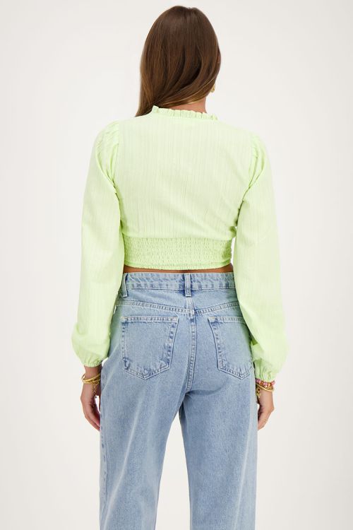 Groene crop top met ruffles en smock