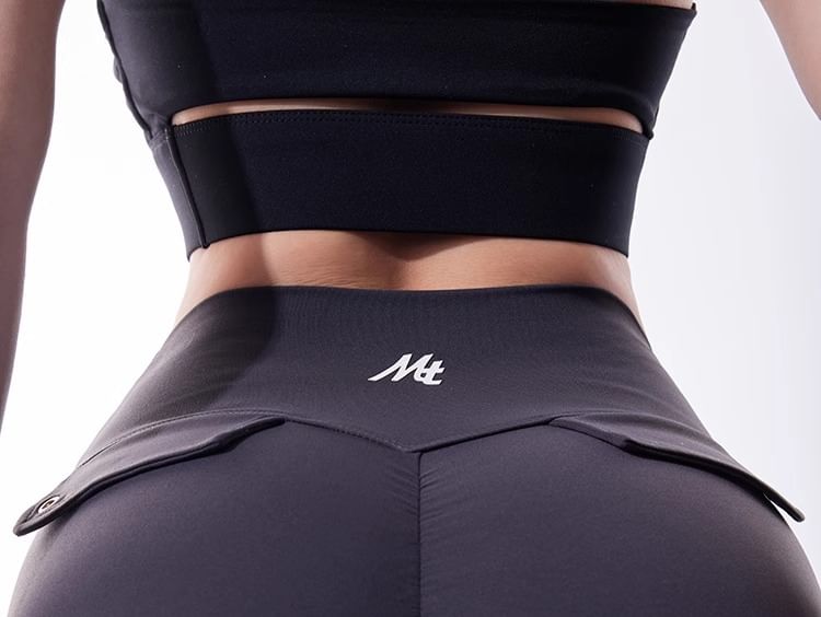 CUCURBIT - Hoge taille, letterprint en uitlopende yogabroek