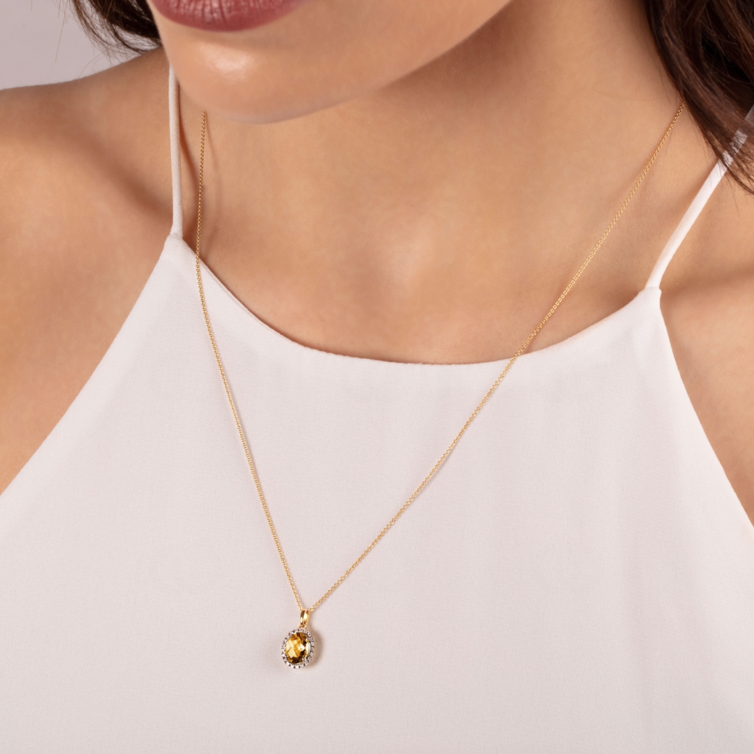 Anhänger 750/18 K Gelbgold mit Citrin oval und Diamanten 0.06 ct H/si