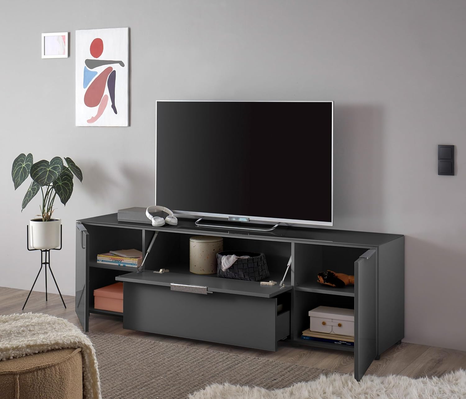 Stella Trading TV-Lowboard Santorin in Anthrazit, TV - TV Schrank für TV bis 65 Zoll mit viel Stauraum für Ihr Wohnzimmer - 180 x 55 x 40 cm (B/H/T)