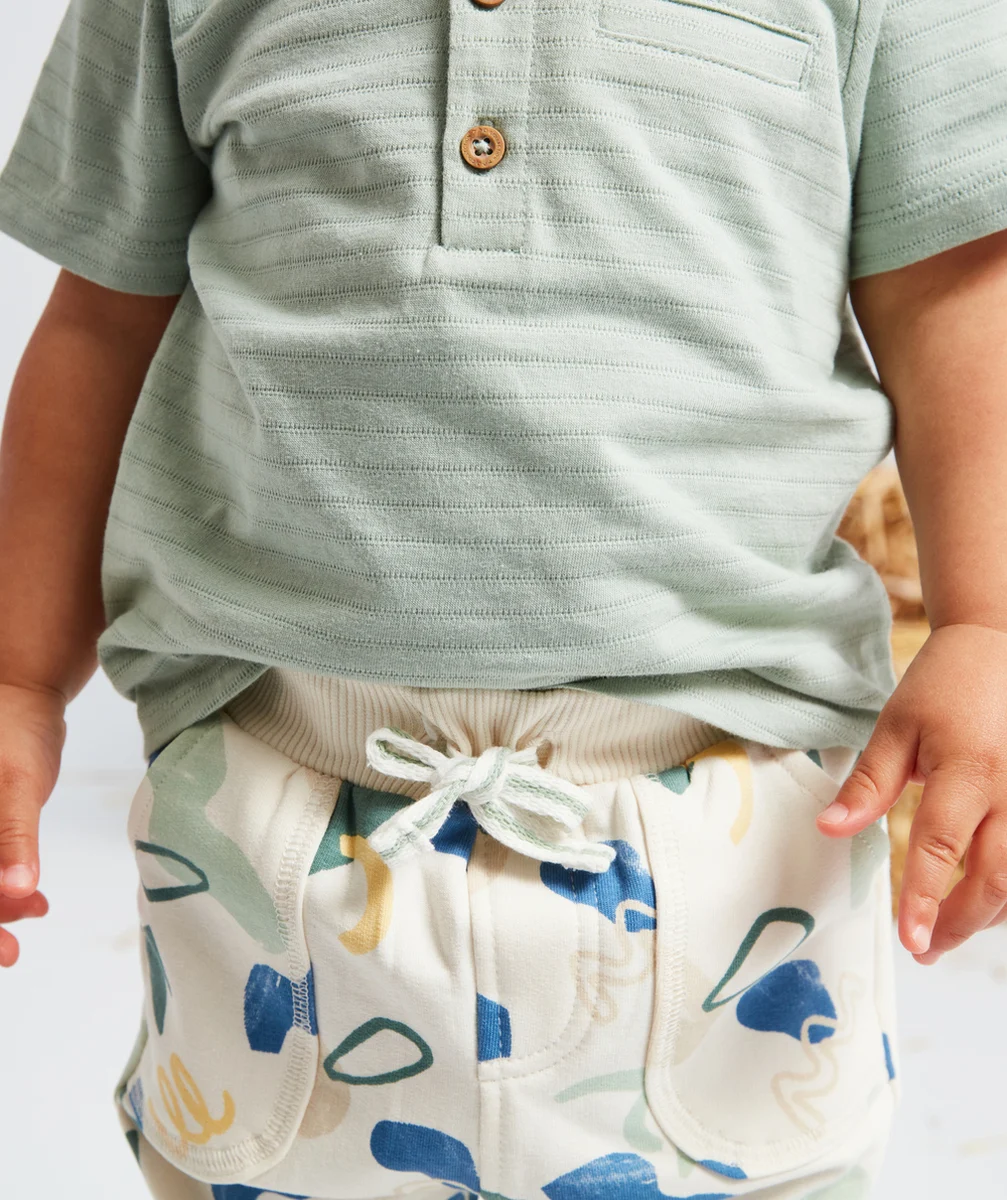 JOGGING BÉBÉ GARÇON ÉCRU AVEC POULPES ET FORMES COLORÉS