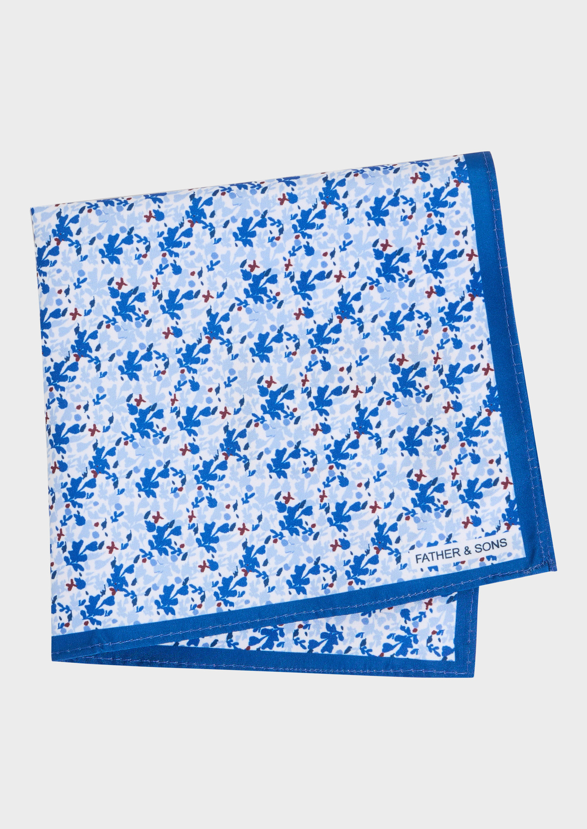 Pochette blanche à motif fleuri bleu cobalt