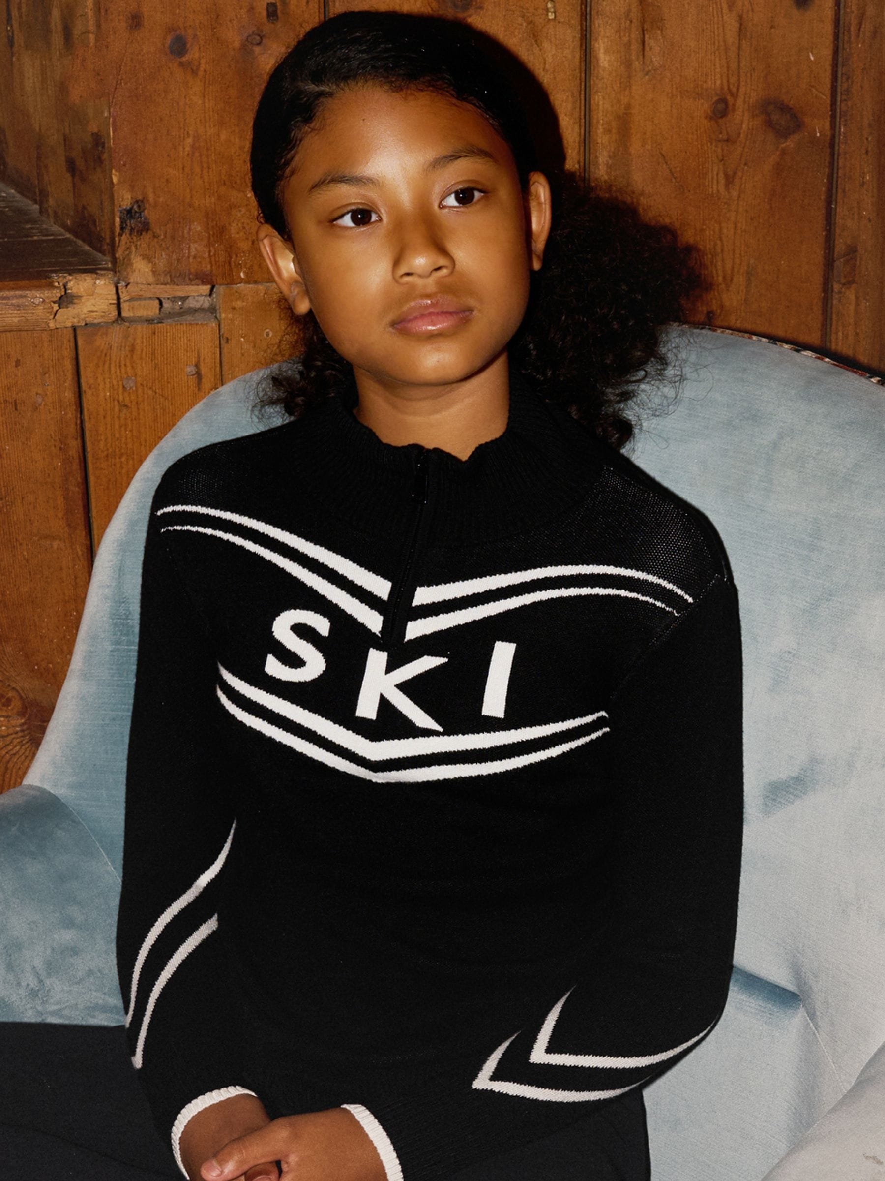 The Little Tailor Zwarte gebreide Kerstmis Trui met ski-ontwerp en rits bij de hals