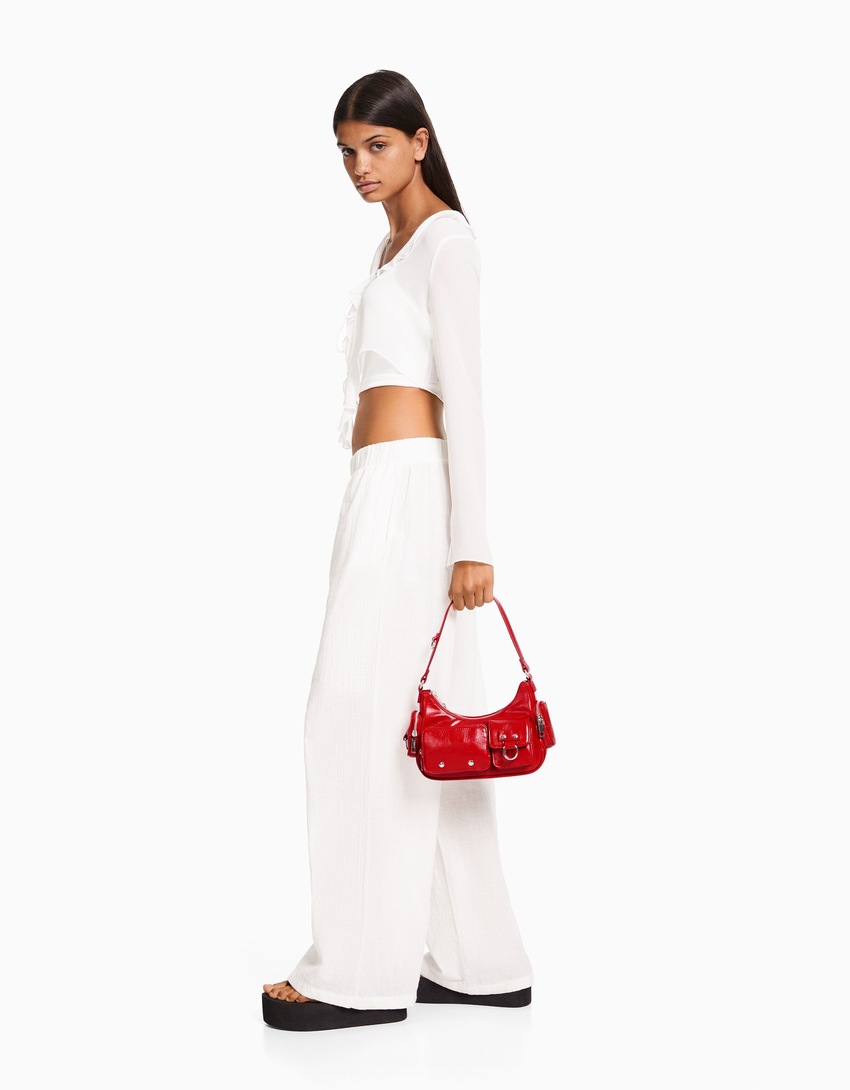 Bolsa de ombro com vários bolsos
