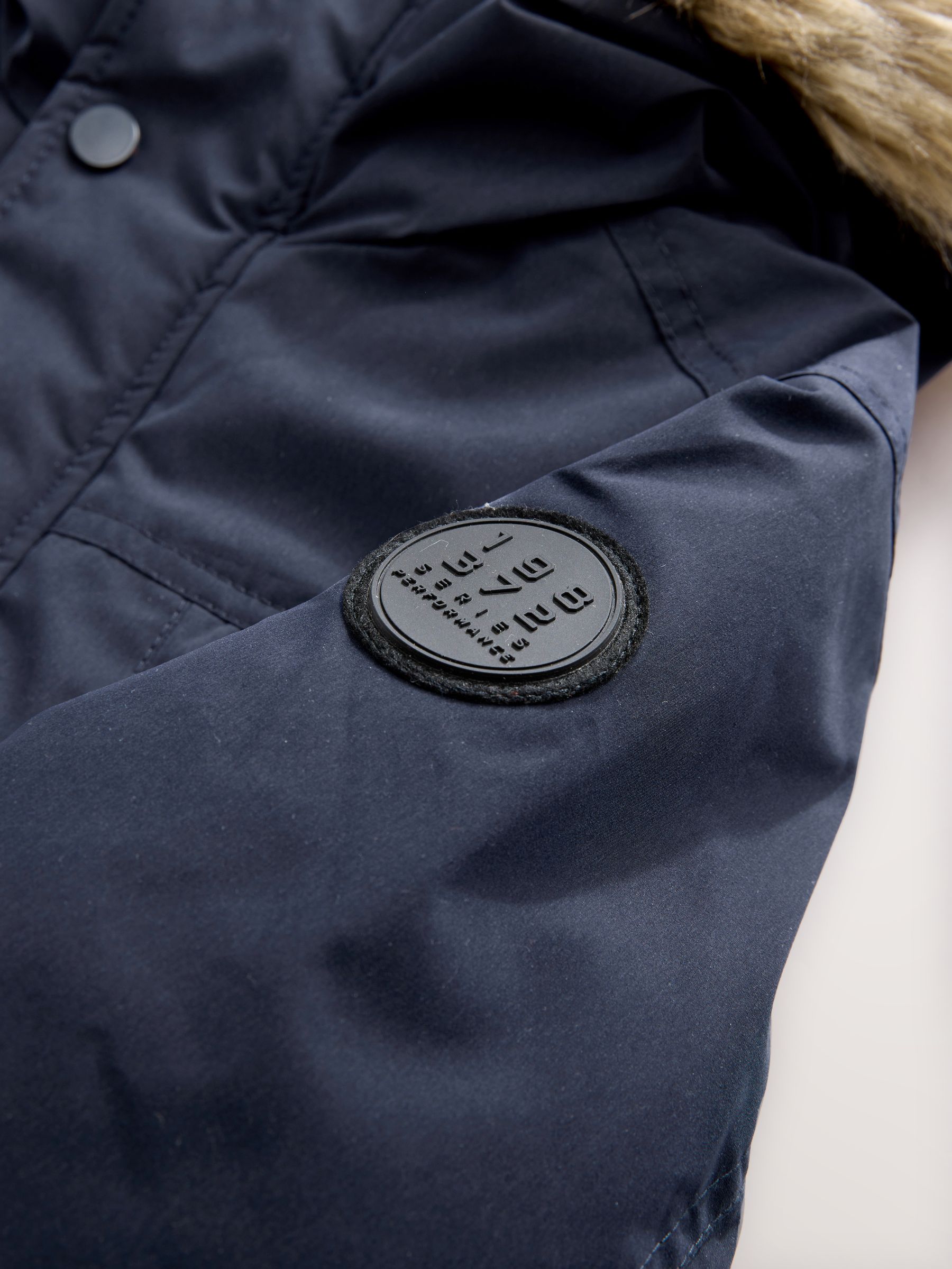 Marineblauw - Zware regenbestendige parka met imitatiebontrand (3-16jr)